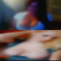 Naked woman riding snowmobile